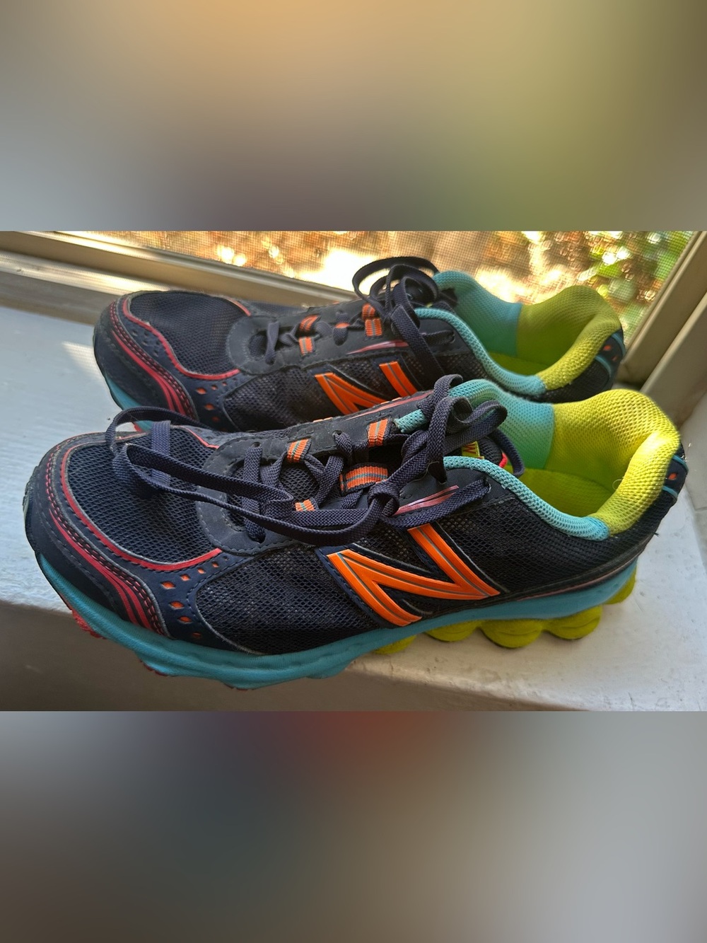New Balance Navy Sneakers with Bright Orange Accents and Lime Lining